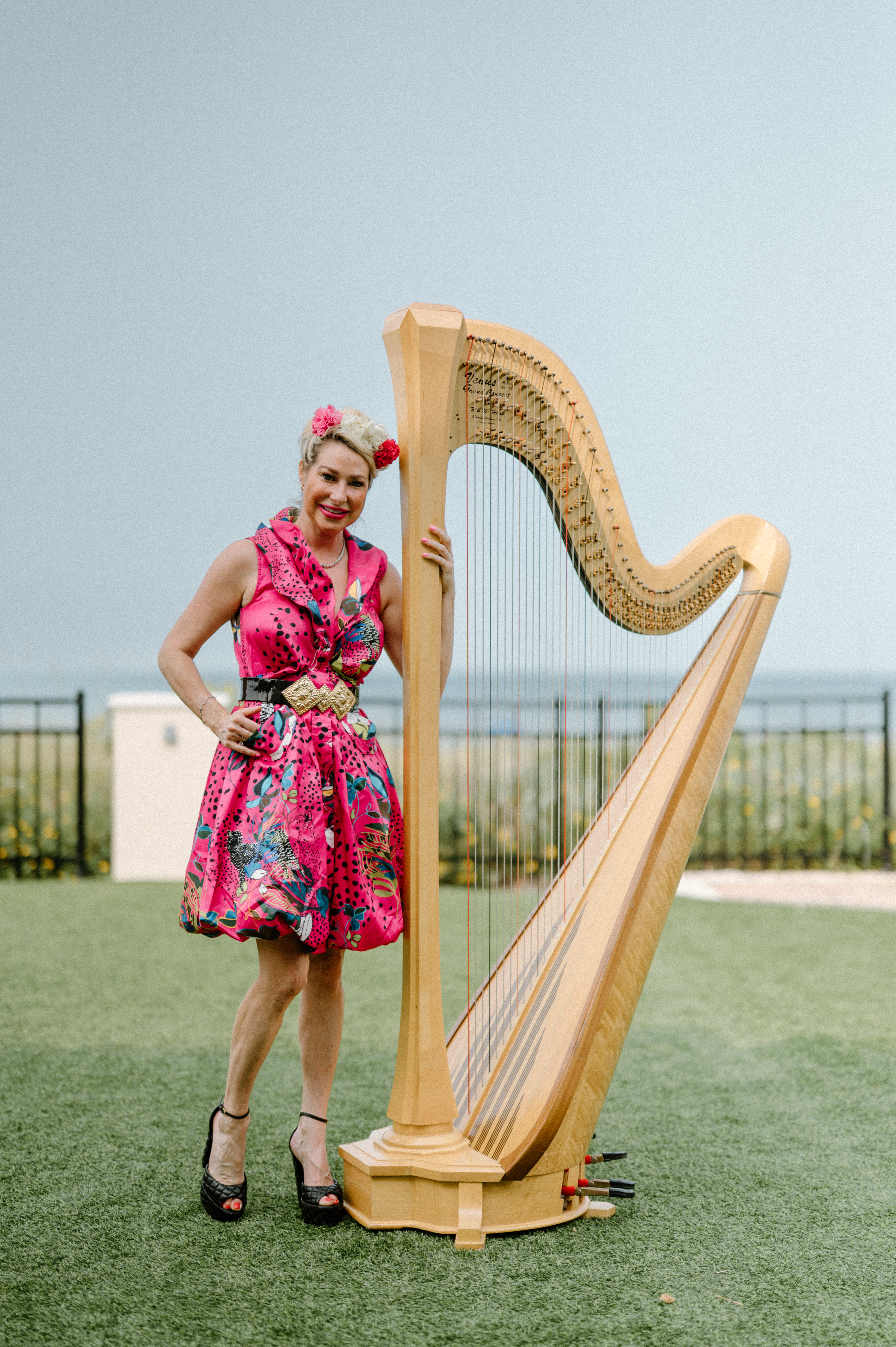 Julia White performing on harp